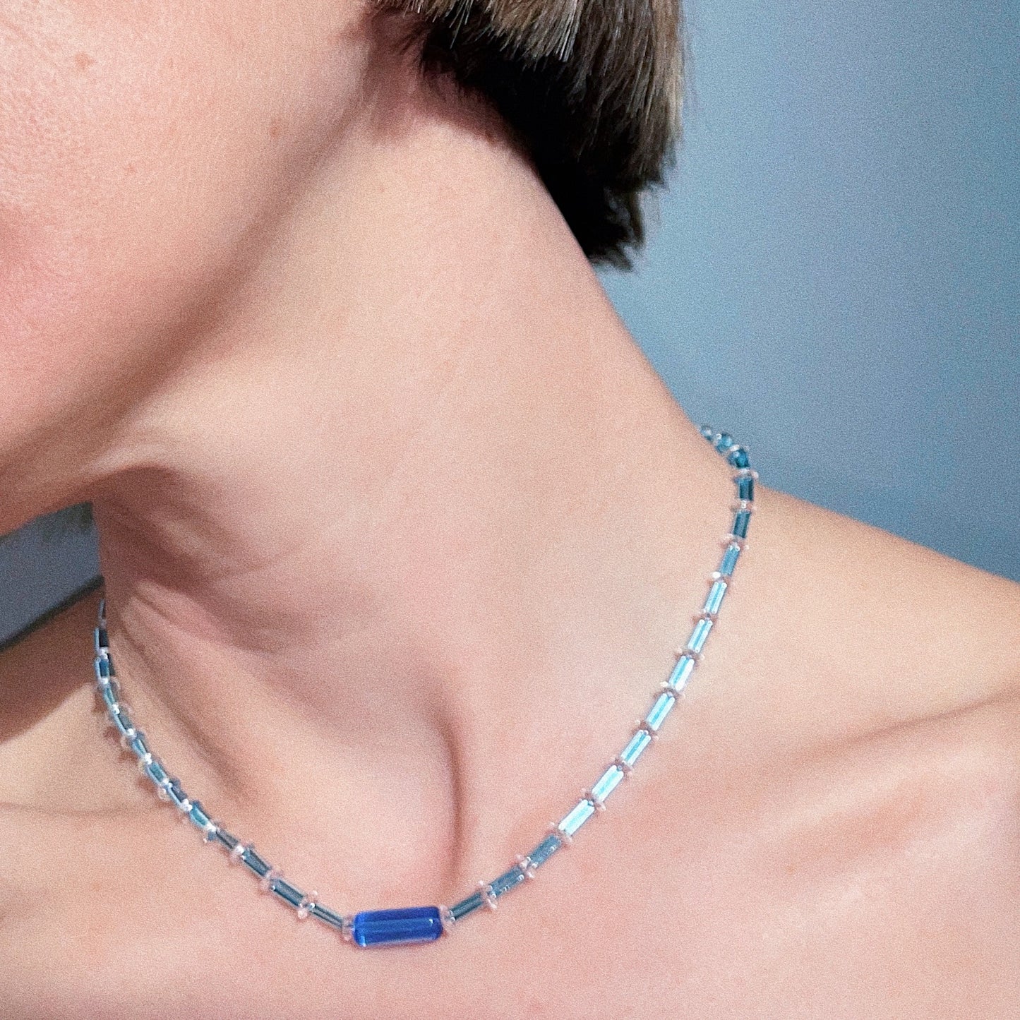 Bluejazz Necklace styled on model – 1920s-inspired Art Deco beaded necklace resting at collarbone, elegant and lightweight for everyday wear