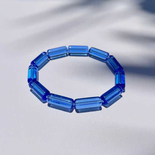 Close-up of Deep Waters bracelet with bold blue transparent beads