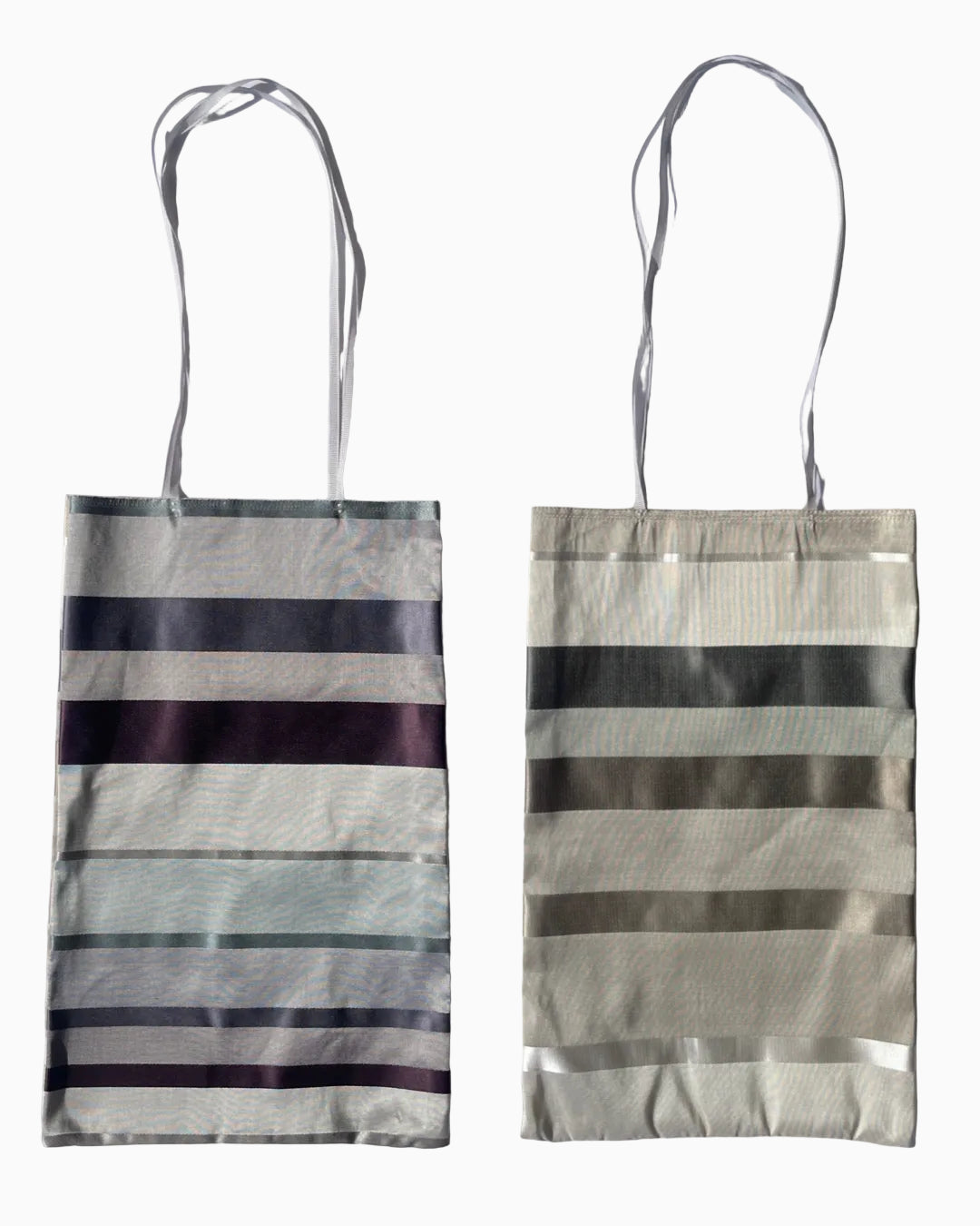 Silk fabric tote bag with horizontal striped patterns.